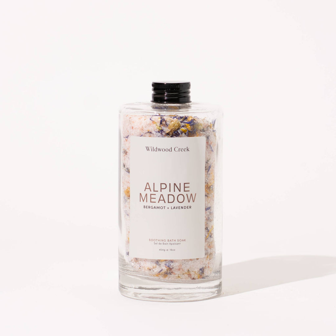 Mineral and Himalayan salt bath salts with wild botanicals in glass bottle