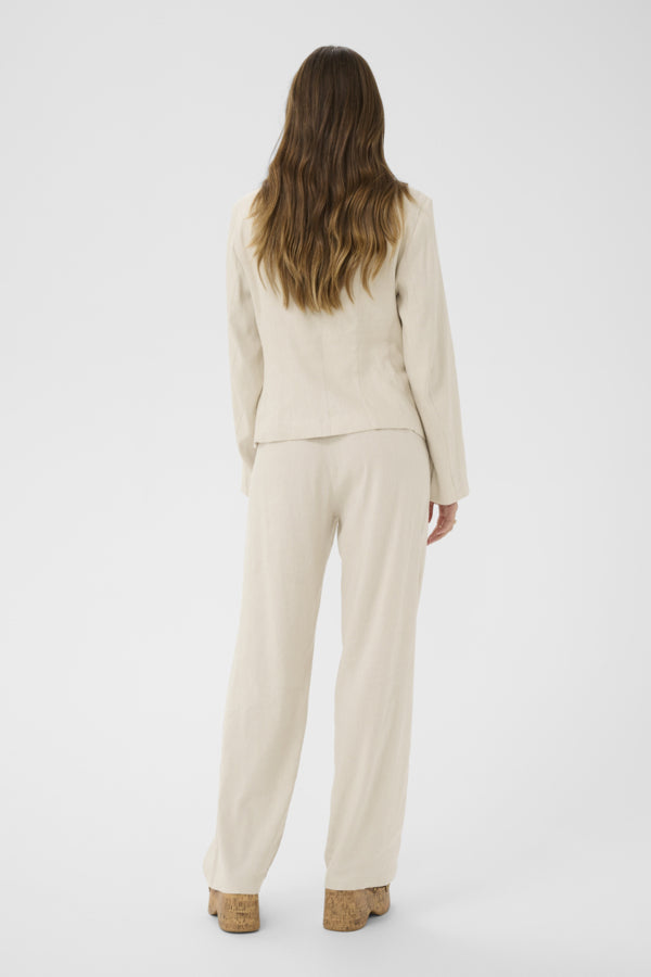 Cream June Linen Blend Blazer displayed on a hanger, featuring a tailored fit and natural linen blend fabric for a stylish look.