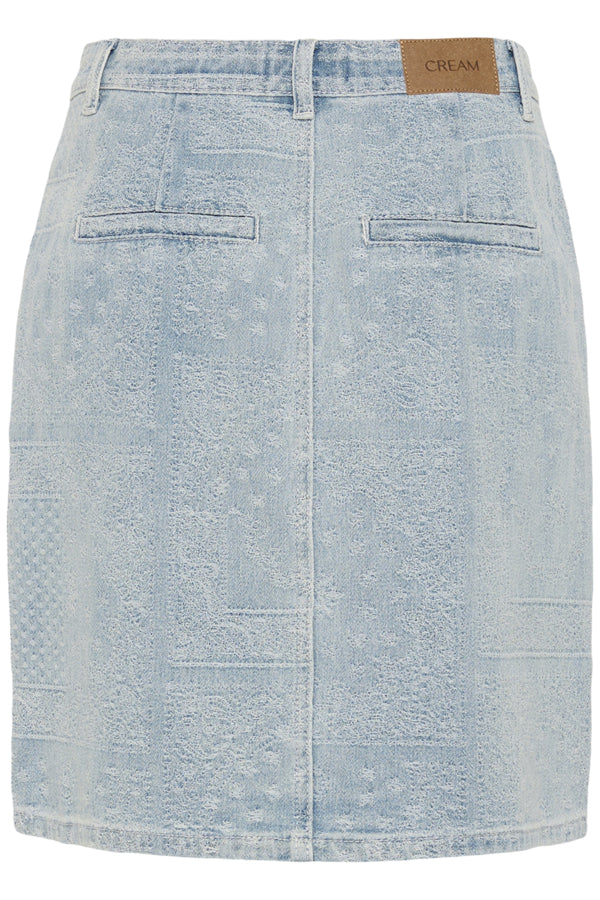 Cream Lucy Light Wash Denim Skirt \showcasing its casual knee length fit and light blue denim fabric.