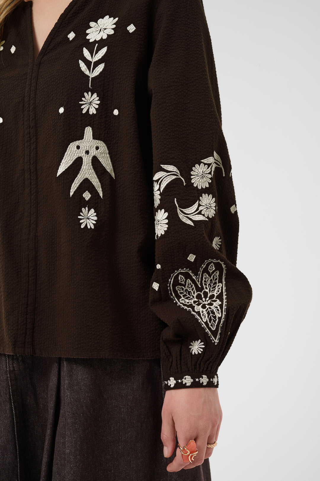 Cream Patulie Folk Embroidered Blouse with intricate colorful embroidery on lightweight fabric.