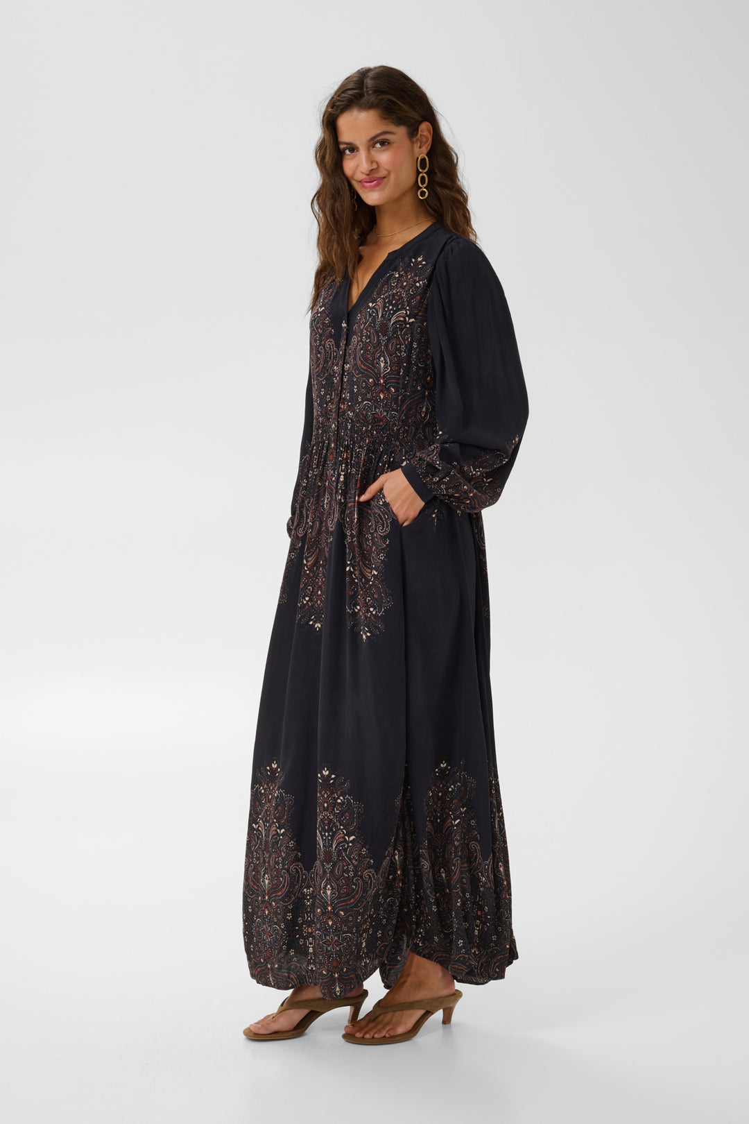 Cream Josia maxi dress displayed on a hanger, featuring flowing fabric and a stylish, elegant design suitable for summer occasions.