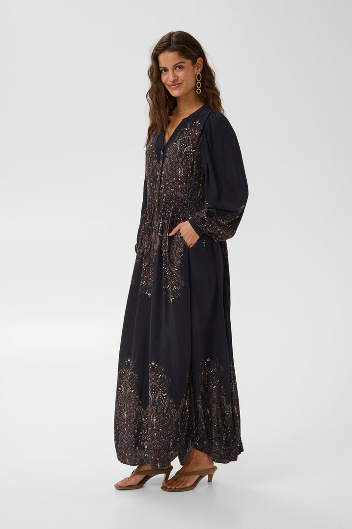 Cream Josia maxi dress displayed on a hanger, featuring flowing fabric and a stylish, elegant design suitable for summer occasions.