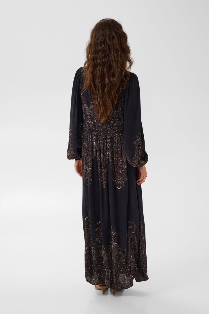 Cream Josia Maxi Dress featuring a flowing silhouette, sleeveless design, and elegant fabric for stylish summer wear.