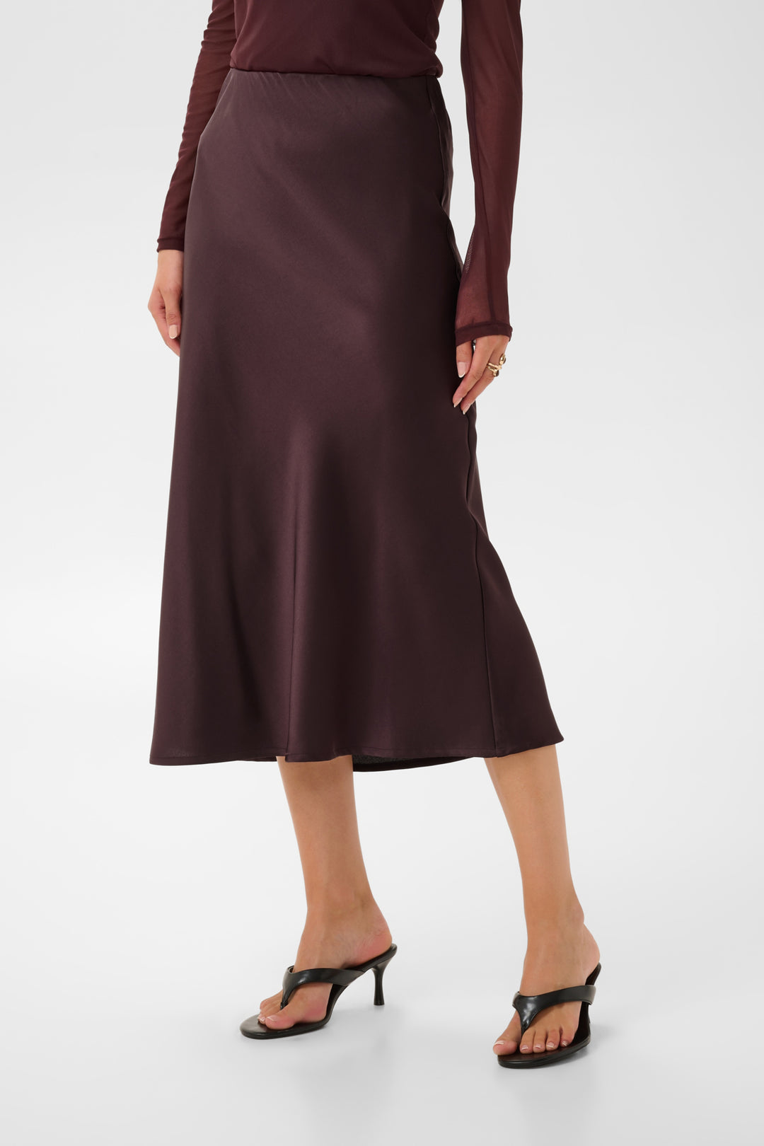 Cream Cocamia midi slip skirt in soft fabric with a sleek, minimalist design, shown on a white background.