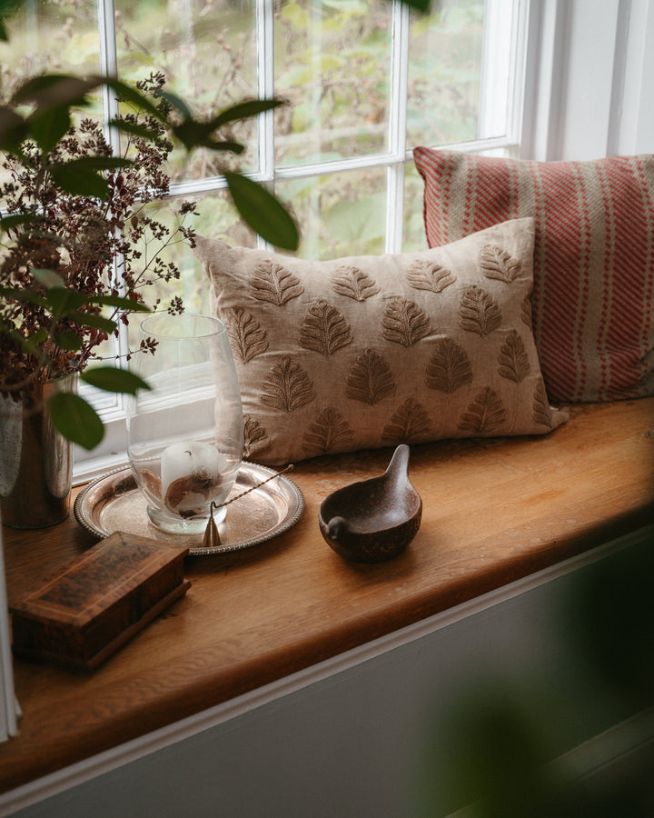 Decorative stoneware bird bowl with debossed design by Creative Co-op, featuring a smooth, rounded shape and detailed bird motif.