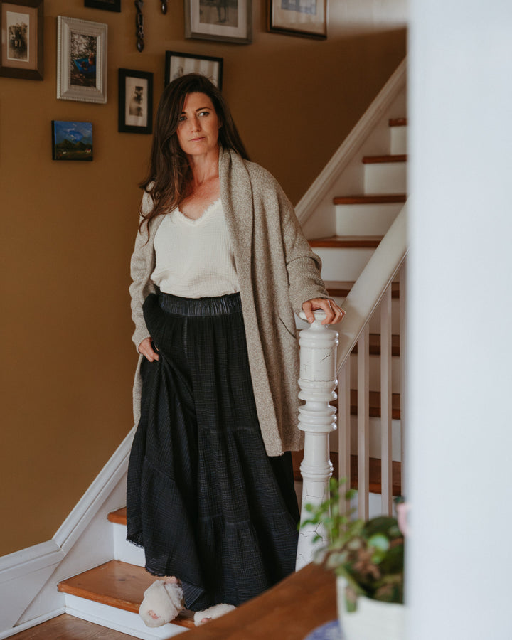 Pokoloko crinkle pants in a relaxed fit with wide legs and a textured fabric, shown in a neutral color.
