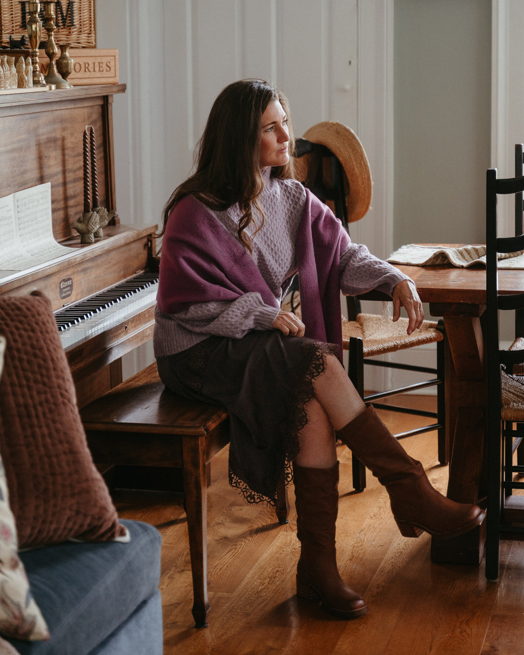 Soft alpaca wool seamless scarf from Pokoloko in a warm palomino color, draped casually showcasing its cozy texture.