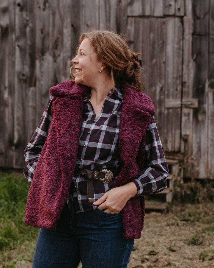 Molly Bracken Bordeau Teddy Vest displayed on a hanger, featuring a soft, plush fabric and classic design.