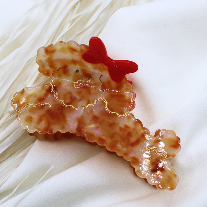 chestnut brown fluffy dog poodle labradoodle red bow in hair claw clip hair accessory hair clip cute dog