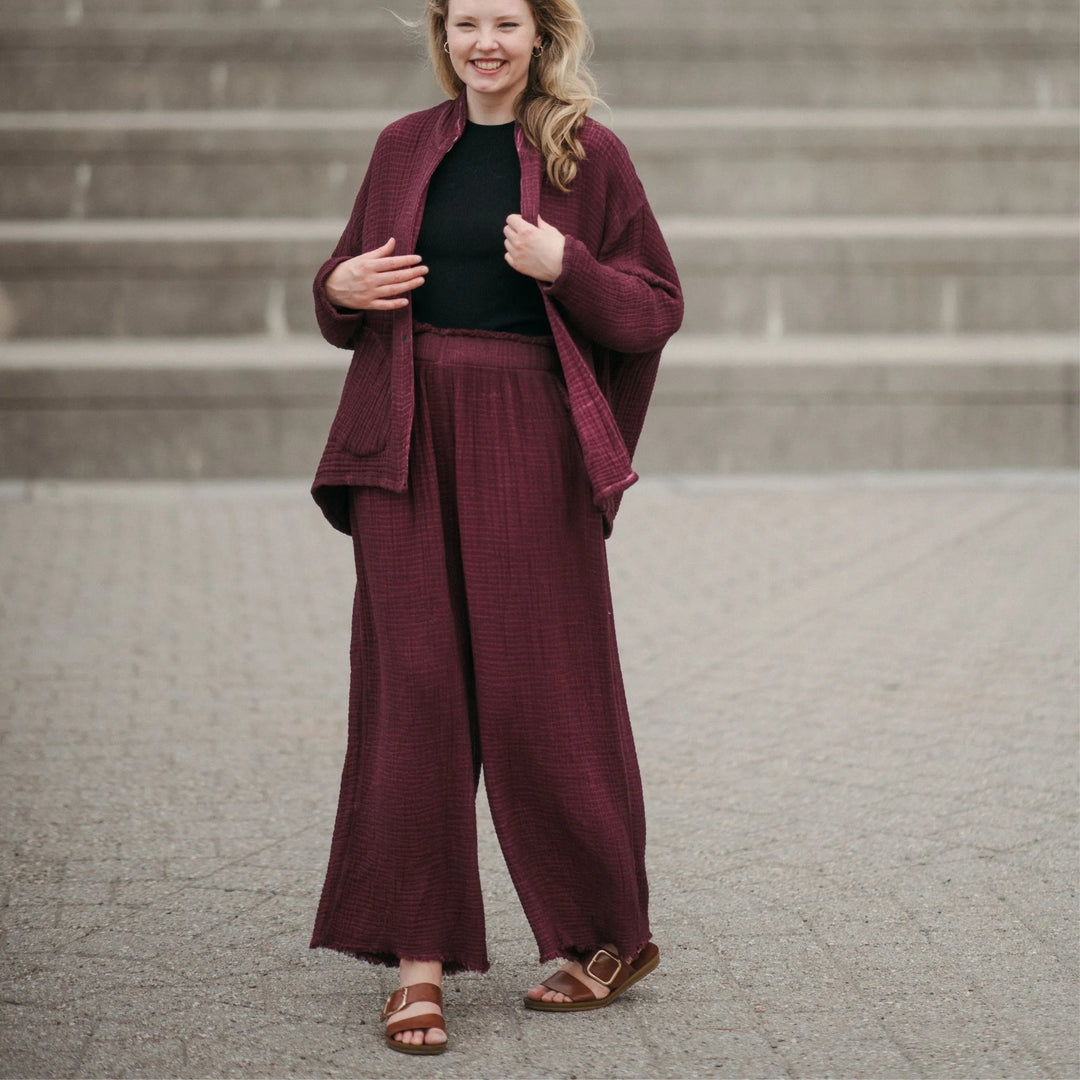 Cranberry crinkle cotton palazzo pant by Pokoloko featuring wide-leg, flowy fabric and layered crinkle design.