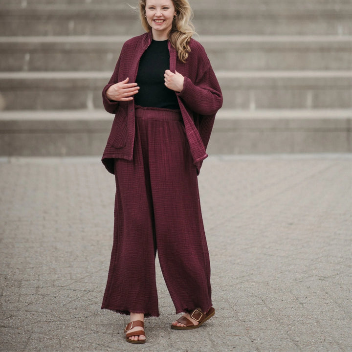Cranberry crinkle cotton palazzo pant by Pokoloko featuring wide-leg, flowy fabric and layered crinkle design.