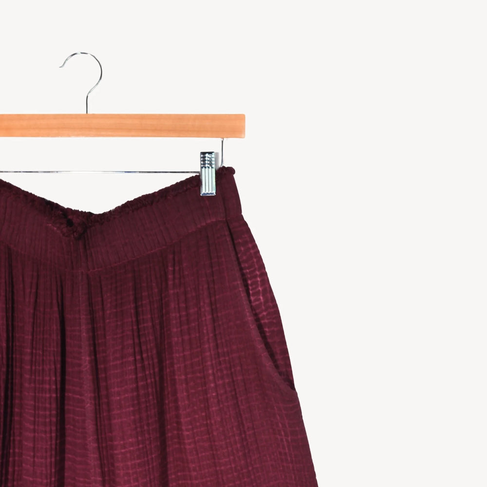 Cranberry crinkle cotton palazzo pant by Pokoloko with a wide-leg, flowing design and layered crinkle texture.