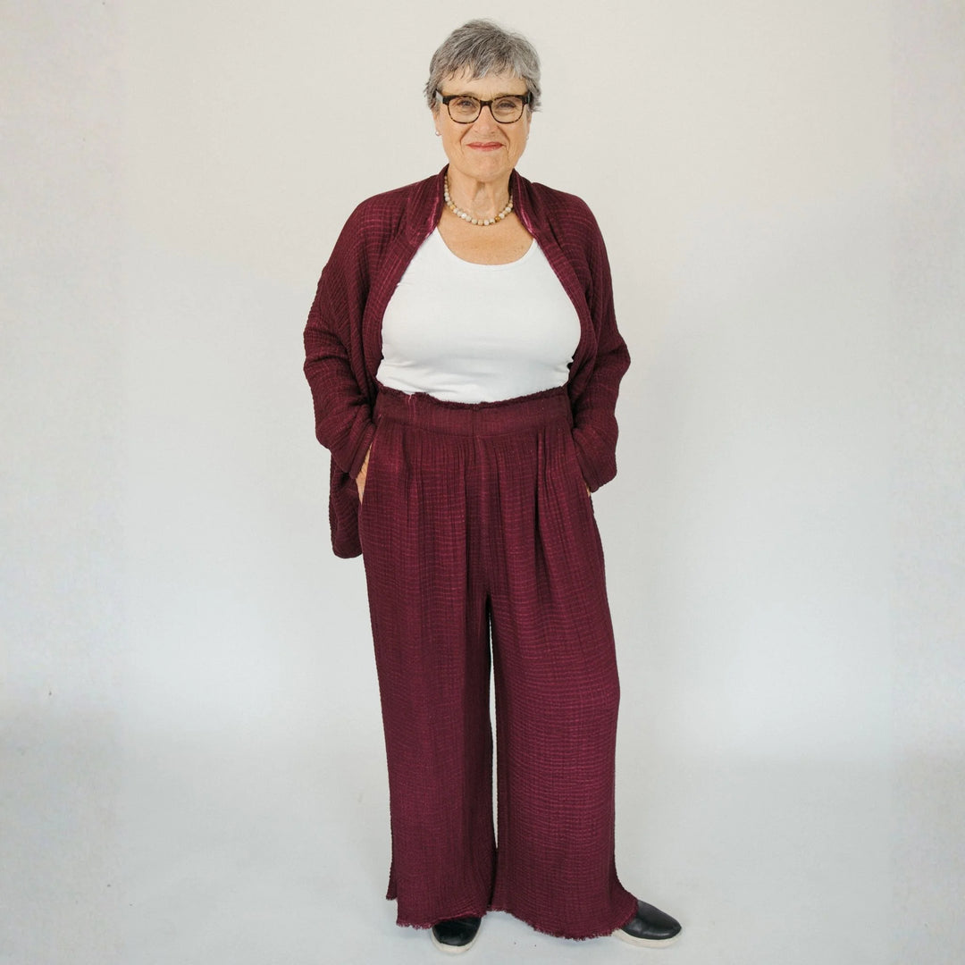 Cranberry crinkle cotton palazzo pant by Pokoloko featuring wide-leg design and textured, lightweight fabric.