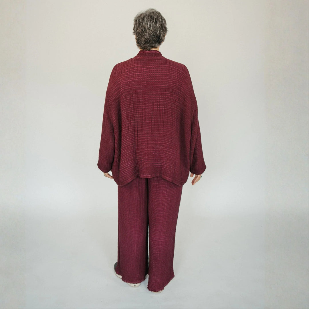 Cranberry crinkle cotton palazzo pant by Pokoloko featuring a wide-leg, flowy design with layered crinkle texture.