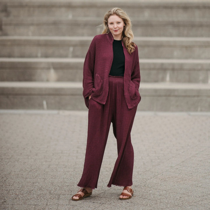 Cranberry crinkle cotton palazzo pant by Pokoloko featuring wide-leg design and layered crinkle fabric for a relaxed, flowy fit.