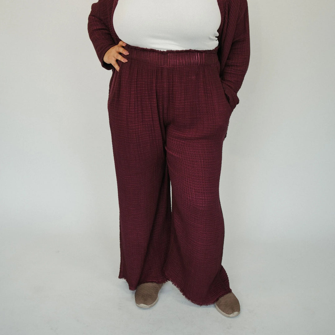 Cranberry crinkle cotton palazzo pant by Pokoloko featuring wide-leg, flowy design and textured crinkle fabric.