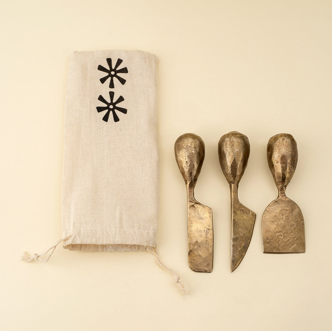 Indaba Rotunda hand-forged cheese knives set with iron handles, perfect for serving and slicing various cheeses.