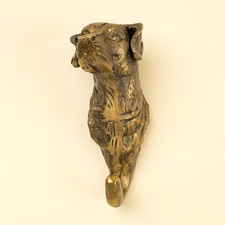 Indaba Best Friend dog wall hook mounted on a wooden wall, featuring a playful dog design for hanging coats or accessories