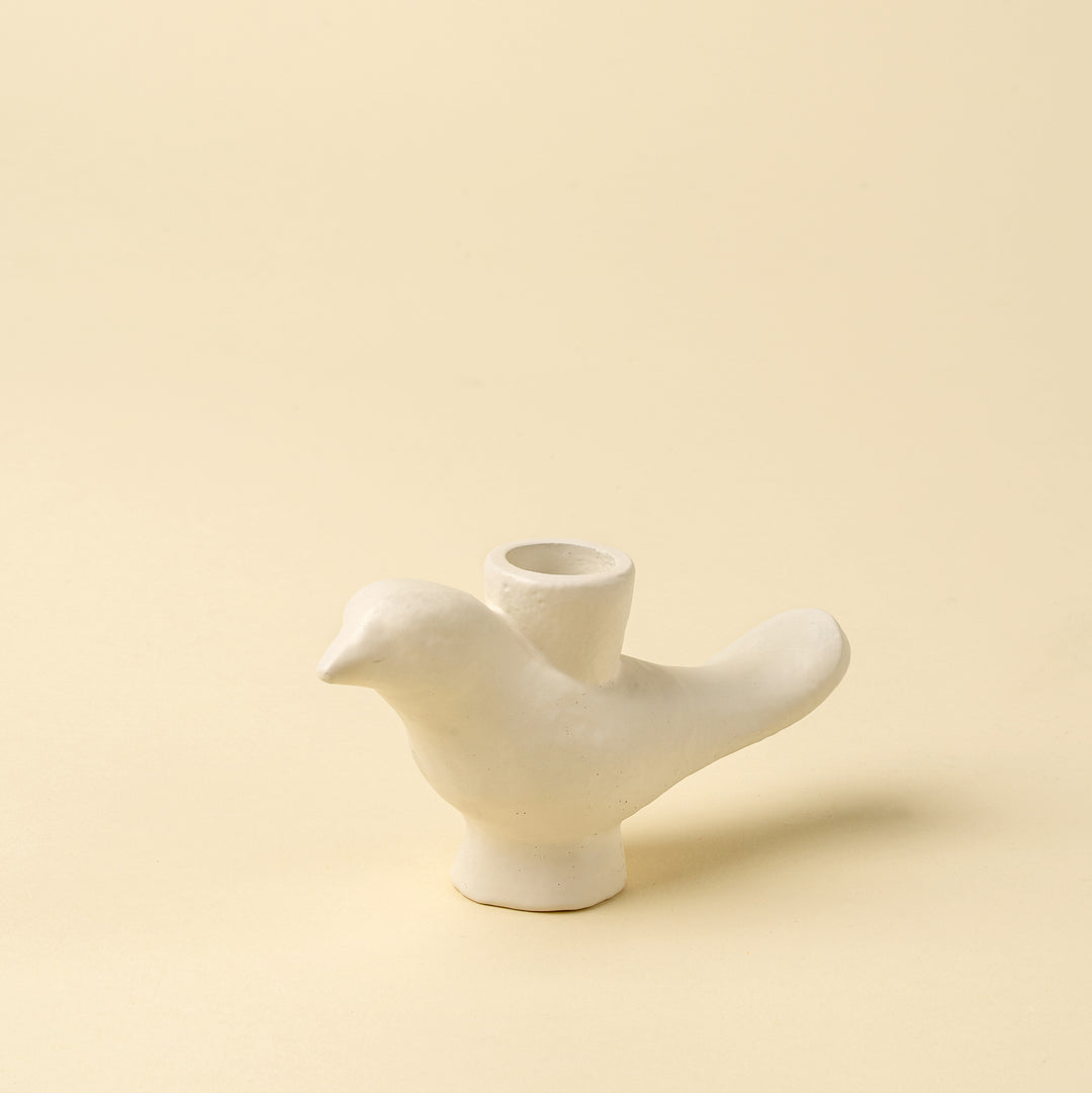 Indaba Wren candle holder with intricate metal bird design, suitable for candles and decorative tabletop display.