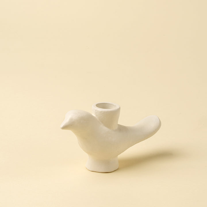 Indaba Wren candle holder with intricate metal bird design, suitable for candles and decorative tabletop display.