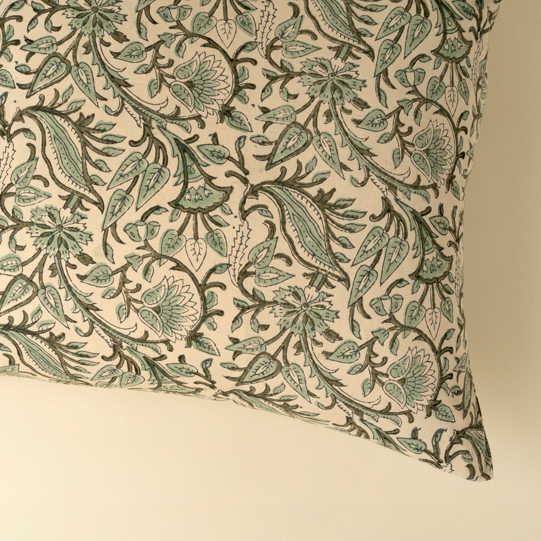 Indaba Rupi Block Print Throw Pillow with vibrant green floral patterns and soft fabric, perfect for cozy home decor.