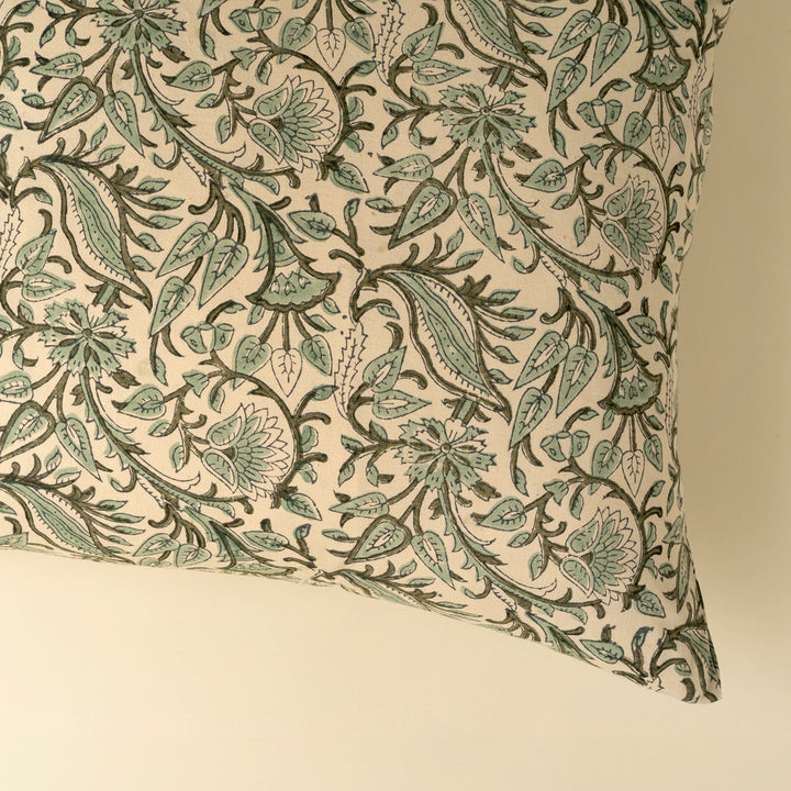 Indaba Rupi Block Print Throw Pillow with vibrant green floral patterns and soft fabric, perfect for cozy home decor.