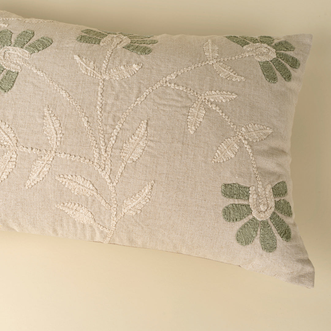 Indaba Petal Soft embroidered throw pillow with floral design, featuring muted soft petal patterns on a cozy fabric background.