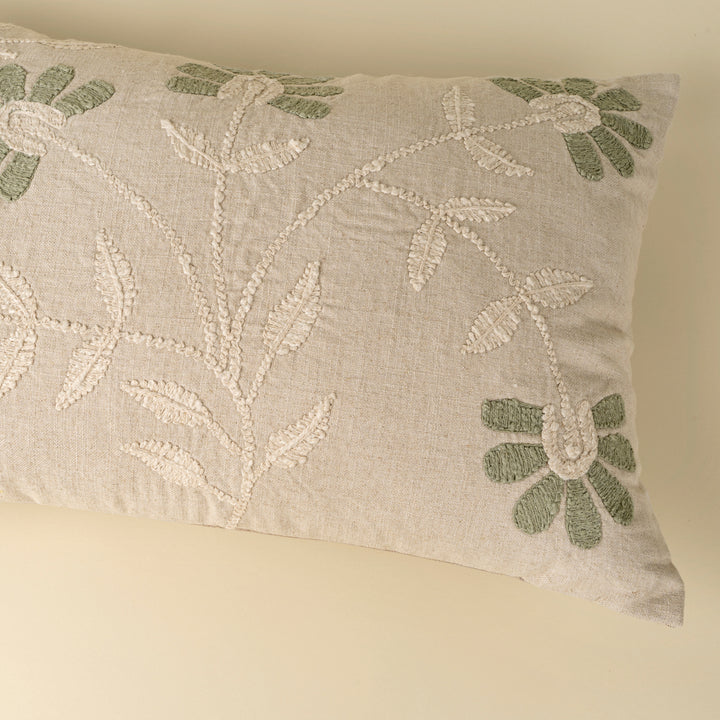 Indaba Petal Soft embroidered throw pillow with floral design, featuring muted soft petal patterns on a cozy fabric background.