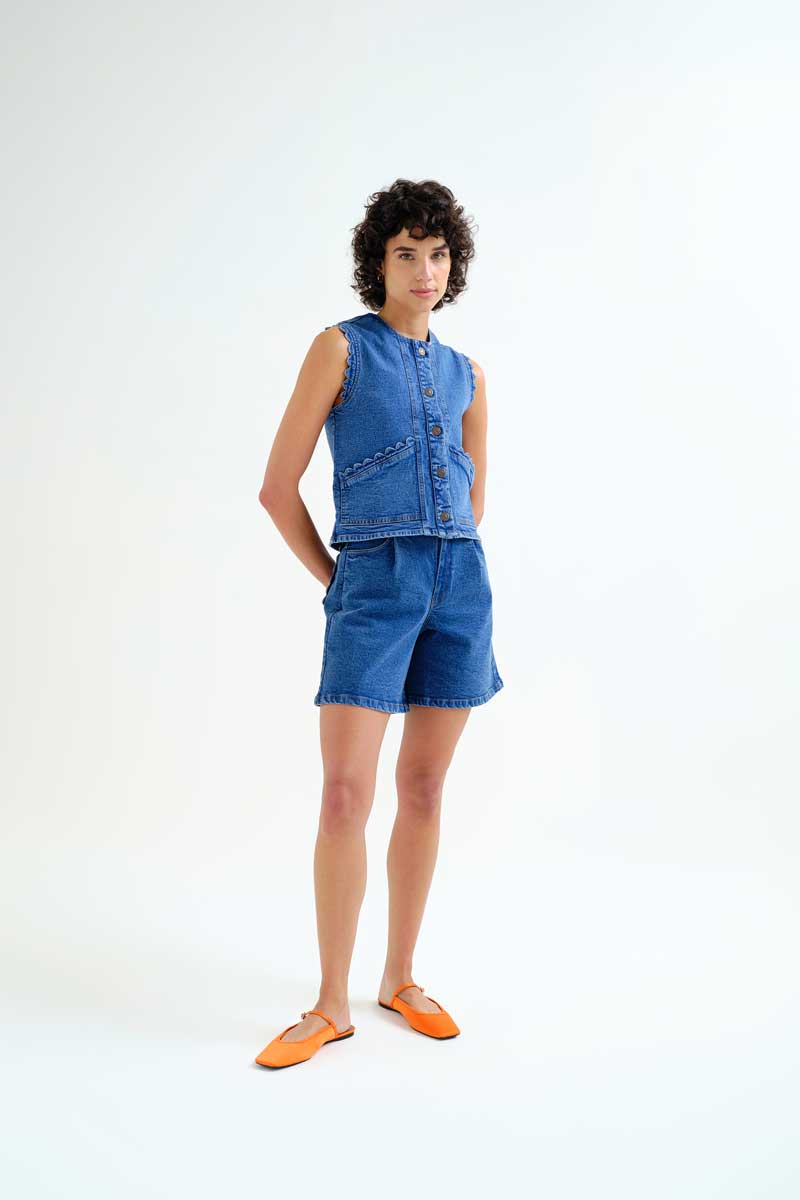 Compania Fantastica Pocketful of Sunshine denim vest with button closure and classic blue denim fabric, scallop detail sleeveless casual style.