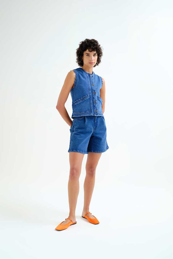 Compania Fantastica Pocketful of Sunshine denim vest with button closure and classic blue denim fabric, scallop detail sleeveless casual style.
