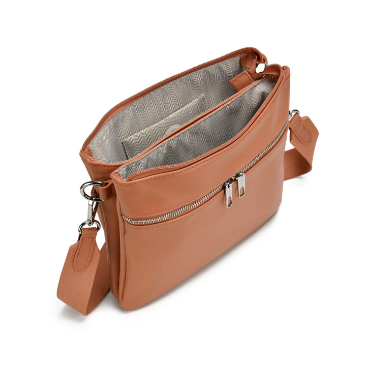 Colab Arquette Crossbody Bag with adjustable strap, featuring a sleek design and spacious interior for everyday use.