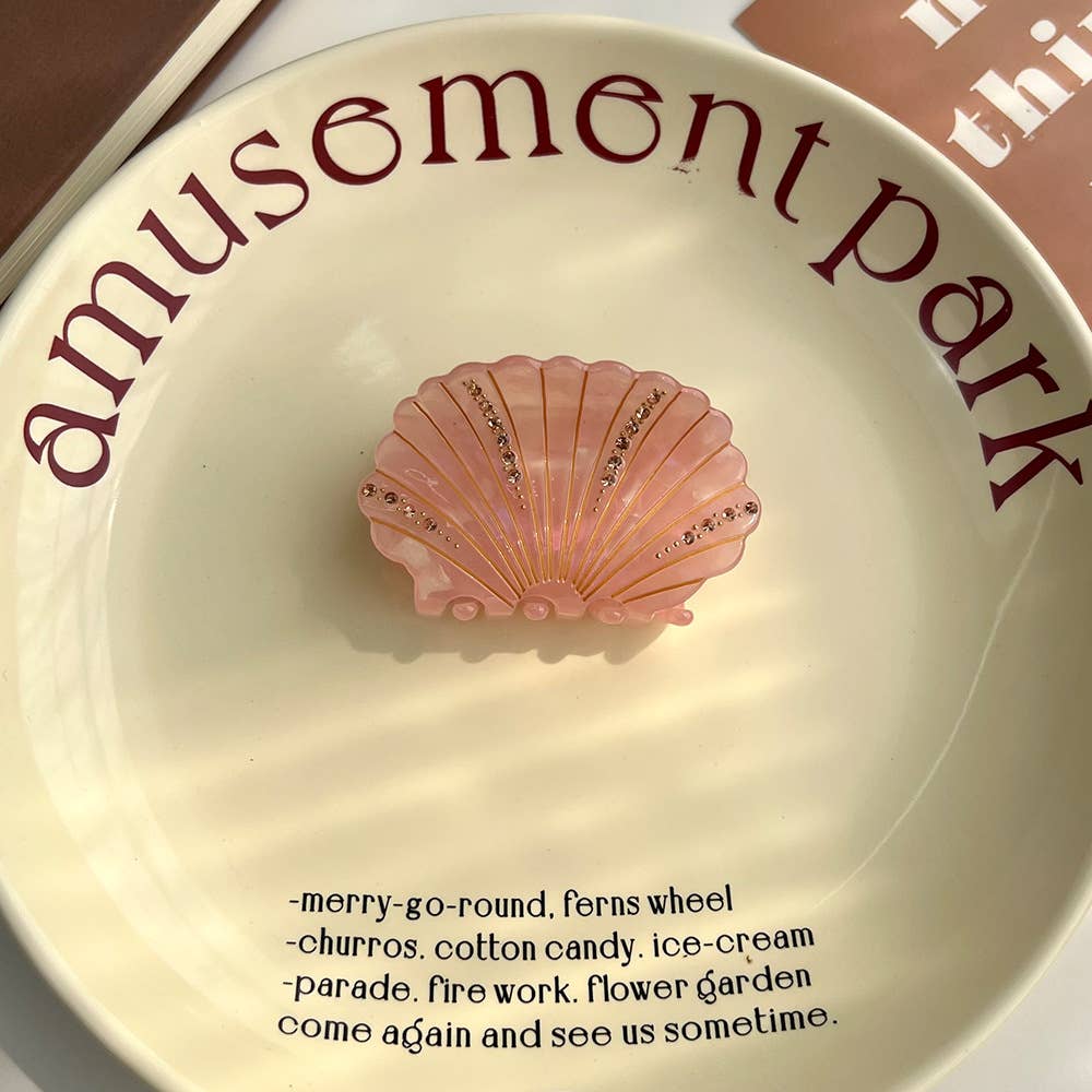 LadyJuneAccessories sea shell claw clip with a natural shell design, perfect for securing hair with a stylish coastal touch.