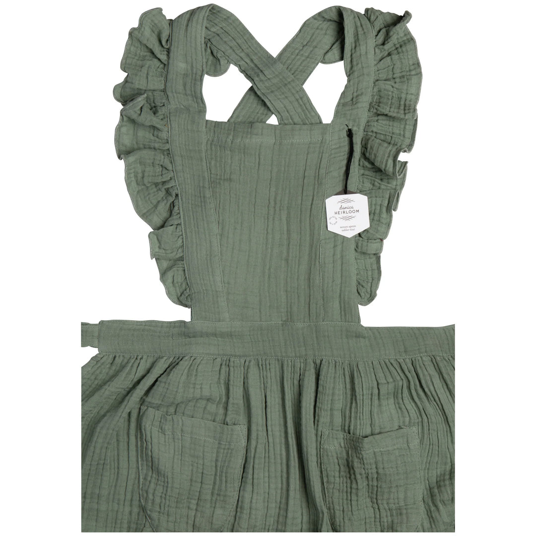 Danica Ada apron featuring a stylish design, adjustable straps, and durable fabric, ideal for cooking or baking activities.
