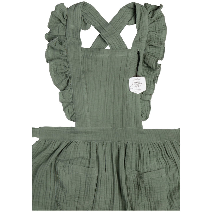 Danica Ada apron featuring a stylish design, adjustable straps, and durable fabric, ideal for cooking or baking activities.