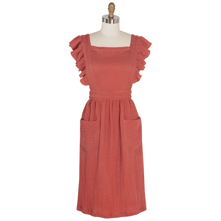 Danica Ada apron featuring a stylish, durable fabric with adjustable straps and a functional front pocket.