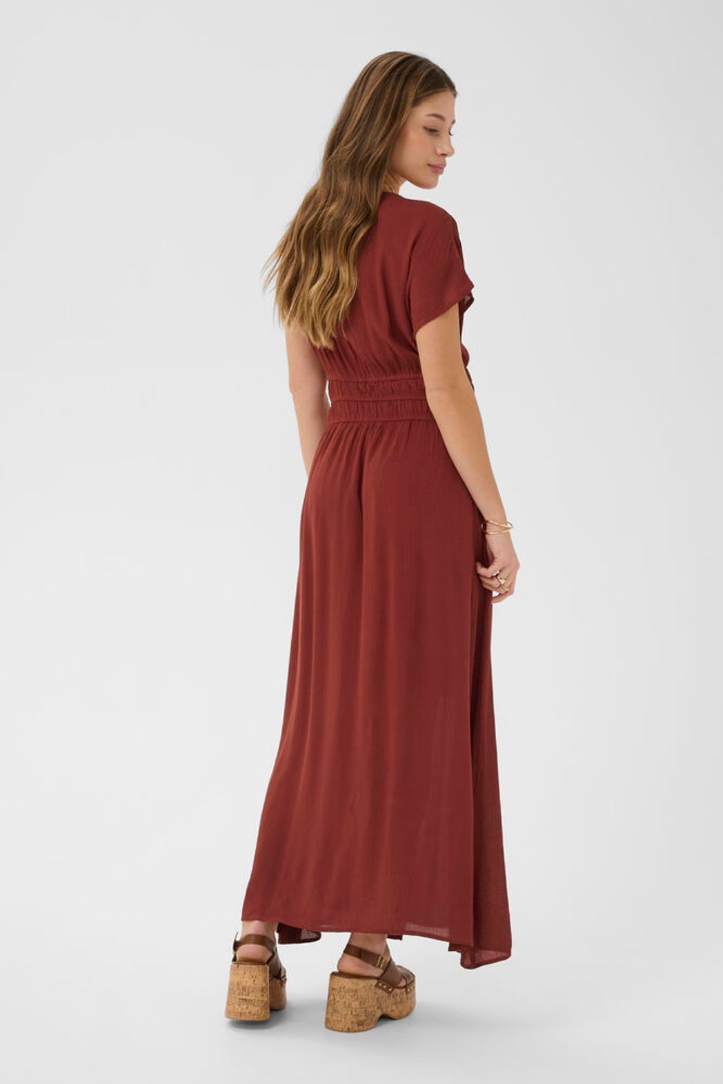 Cream Allie Maxi Dress featuring a flowing boho silhouette, with a V-neckline and sleeveless design, perfect for elegant summer wear.