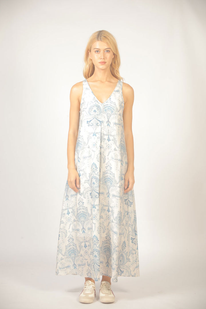 Woman wearing a floral dress on a white background