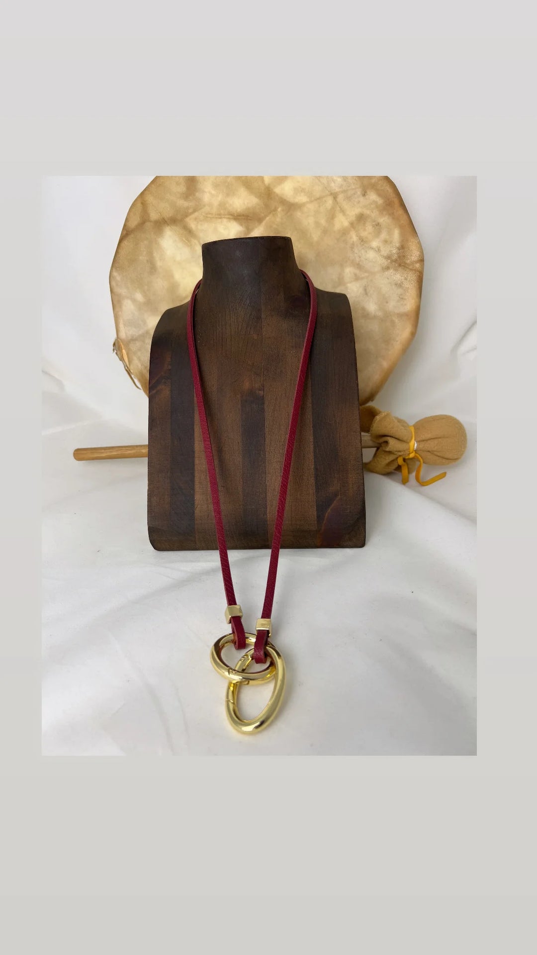 Red and gold Avril Slim Necklace by Lofttan featuring a delicate chain and modern pendant design.