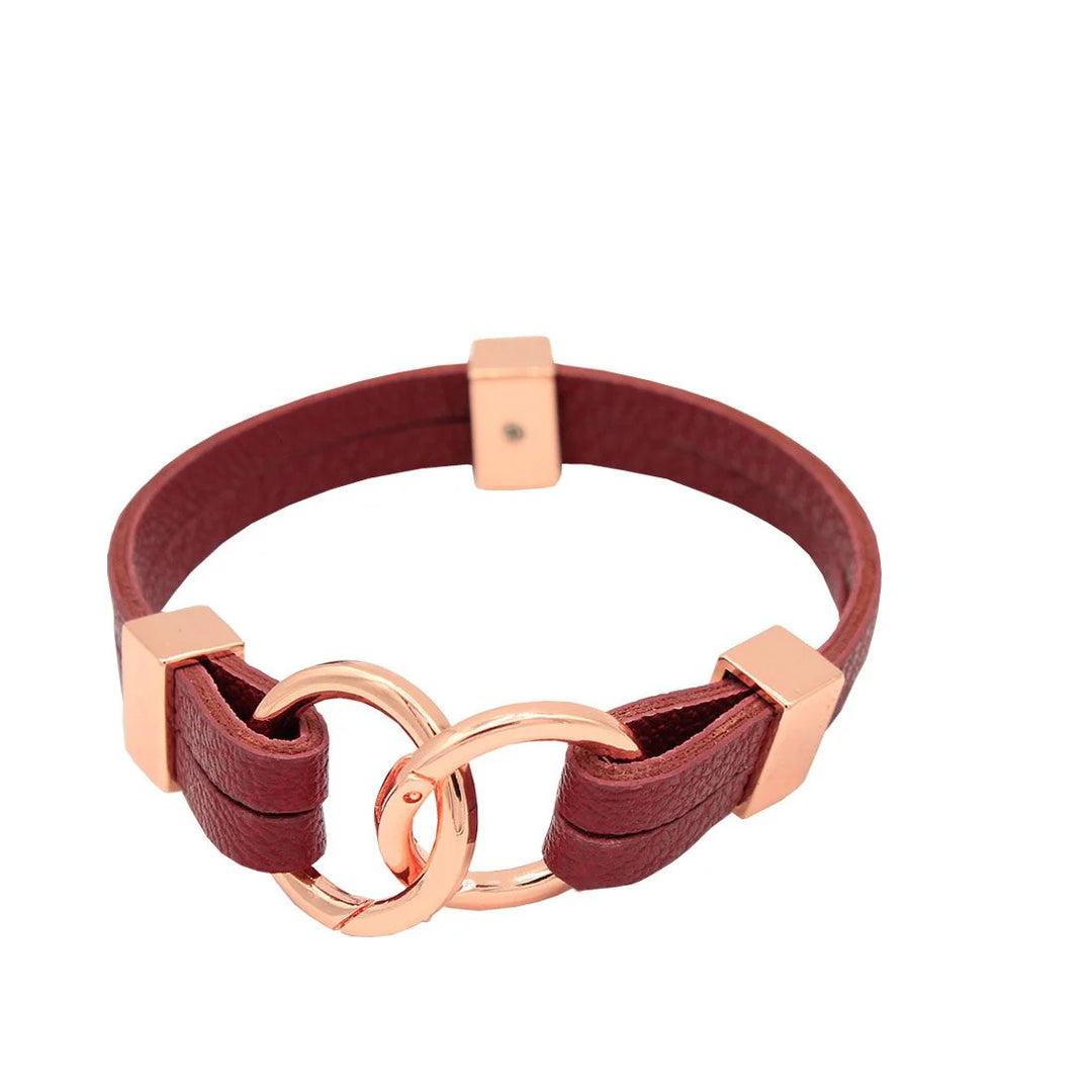 dark red leather bracelet with rose gold hardware on a white background
