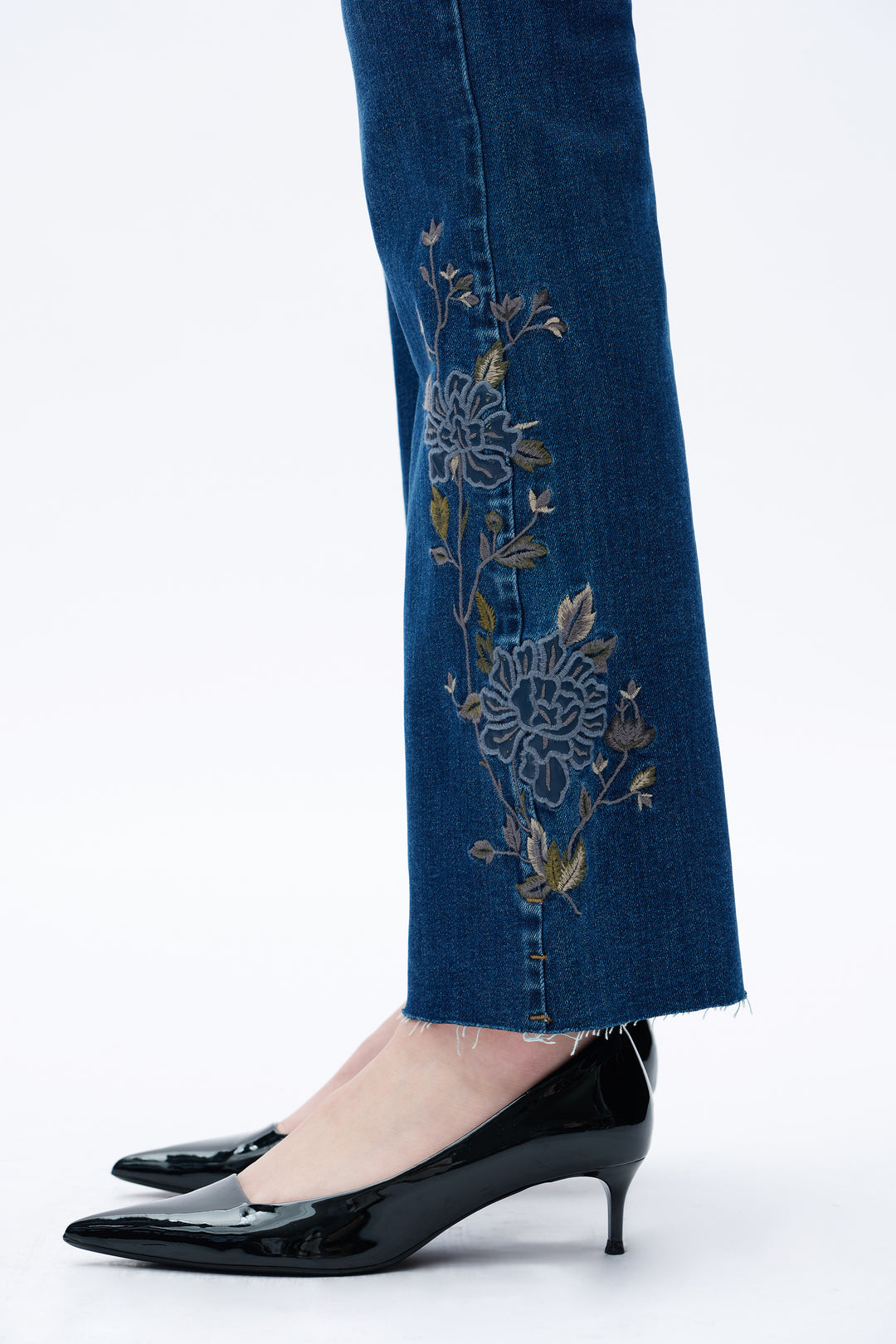 Bayeas Wildflower Trail wide leg jeans featuring a relaxed fit, light denim wash, and floral embroidery on the sides .