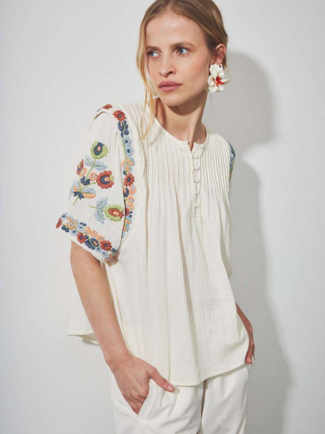 Louizon floral embroidered blouse top featuring intricate floral embroidery and lightweight cotton fabric, perfect for casual or dressy wear.