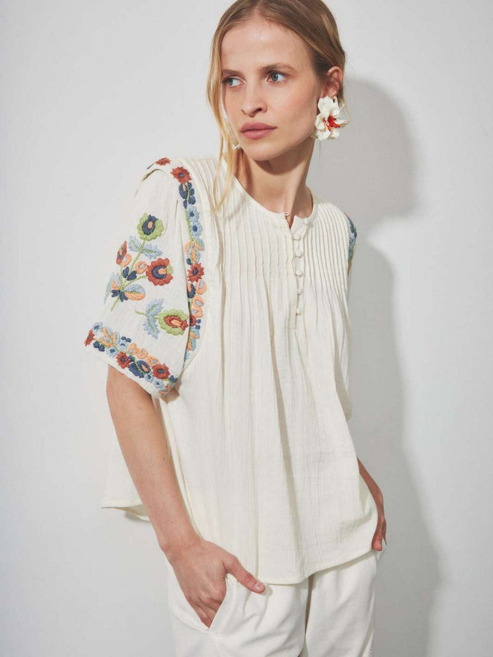 Louizon floral embroidered blouse top featuring intricate floral embroidery and lightweight cotton fabric, perfect for casual or dressy wear.