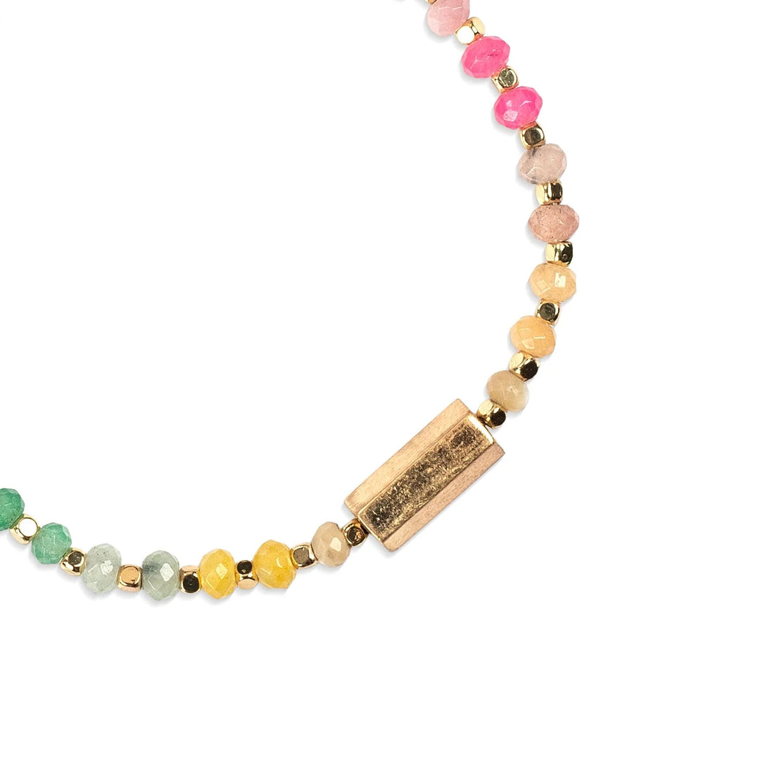 Scout Chakra Glow Beaded Bracelet featuring colorful aura-inspired beads and adjustable cord for a stylish, spiritual accessory.