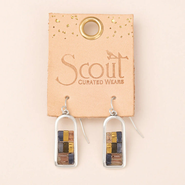 Beaded glass earrings in dark blue, silver, gold, and blush tones. 