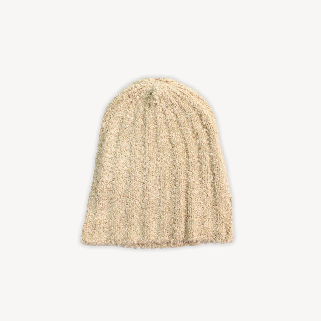 Beige knit beanie on a white background