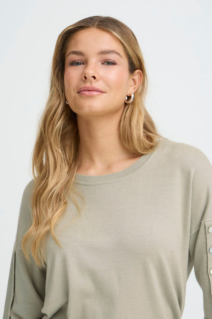 FRANSA Desert Sage knit top featuring a soft fabric with a relaxed fit and 3/4 sleeves with button details.