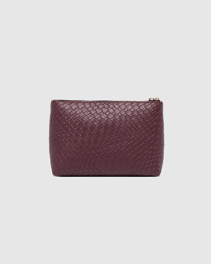 Woven leather pouch in burgundy on a light gray background