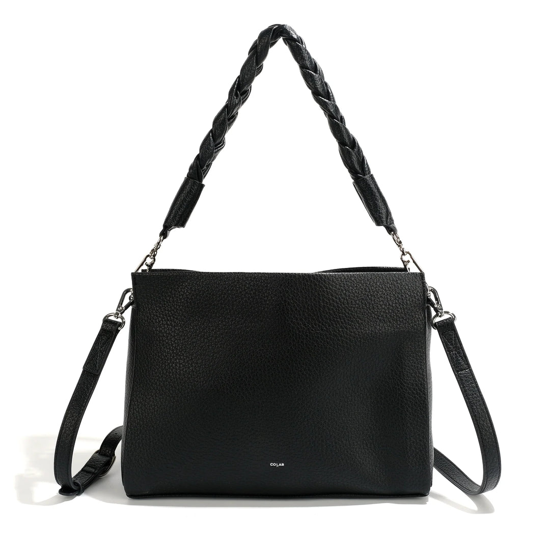 CoLab Camden crossbody bag in neutral fabric with adjustable strap, compact and stylish for everyday use.