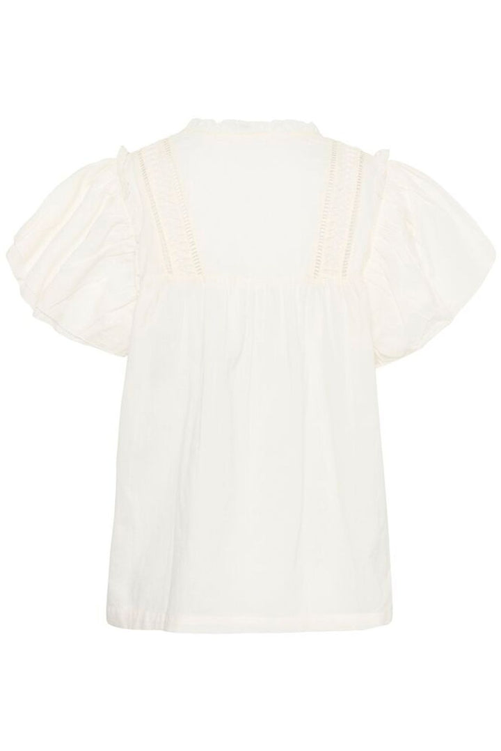 Culture Catinka cotton blouse displayed on a hanger, showcasing its soft fabric and stylish design.