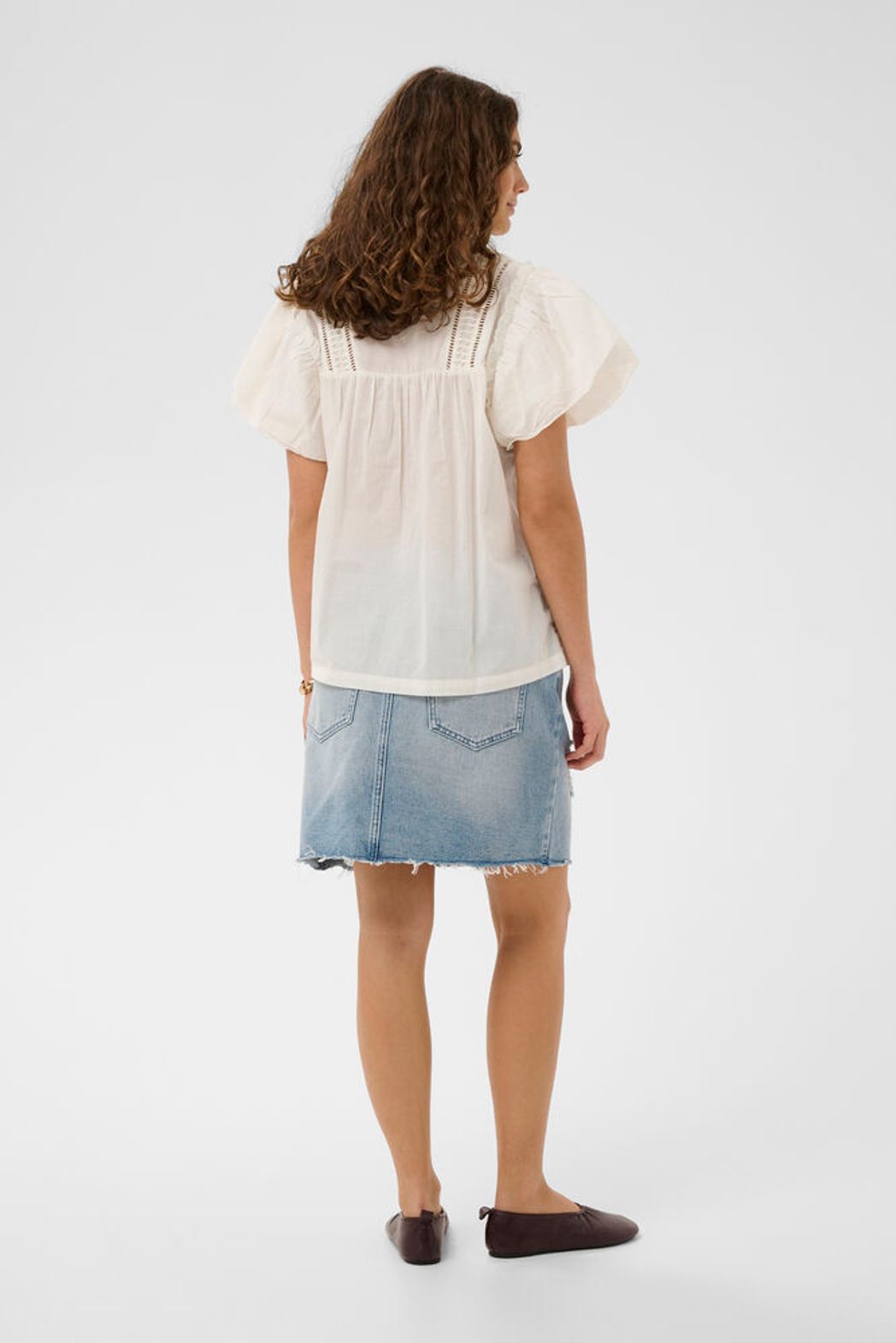 Culture Catinka Cotton Blouse featuring a lightweight, boho design with a relaxed fit and short ruffle sleeves.